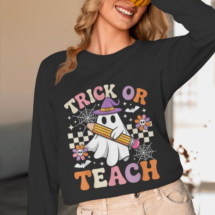 Trick Or Teach Groovy Teacher Halloween Retro Ghost Women Long Sleeve T-Shirt, novelty gifts, funny gifts