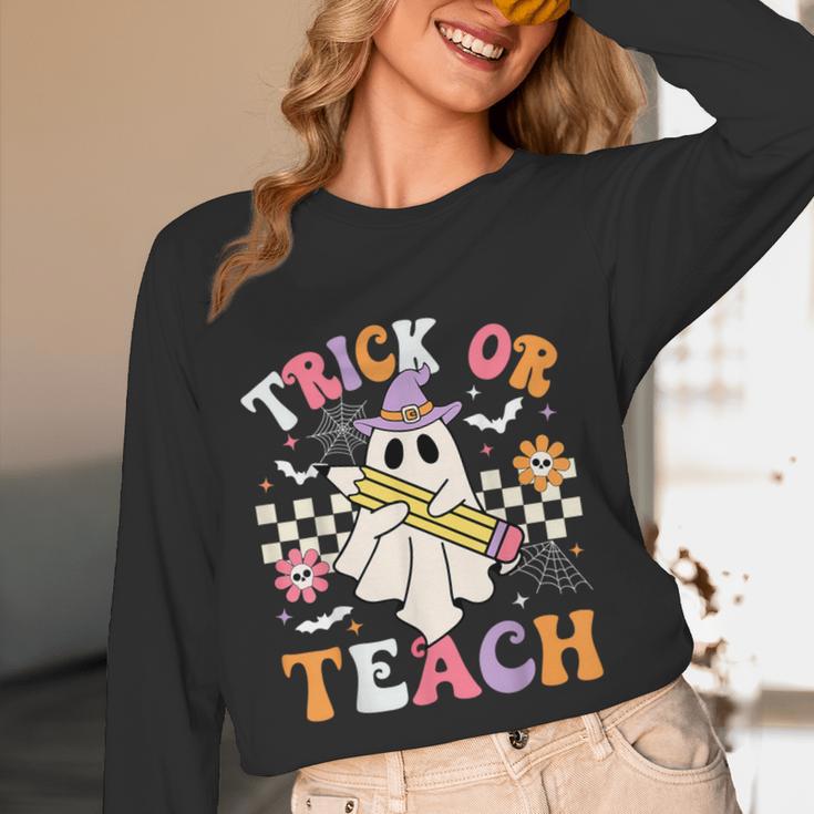 Trick Or Teach Groovy Teacher Halloween Retro Teacher Ghost Women Long Sleeve T-Shirt, novelty gifts, funny gifts