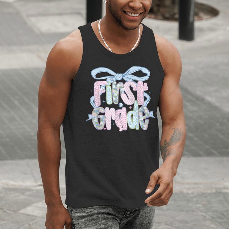 First Grade Coquette Bow Girls Teacher Team 1st Grade Squad Men Tank Top, First Grade Teacher Tank Tops, funny gift