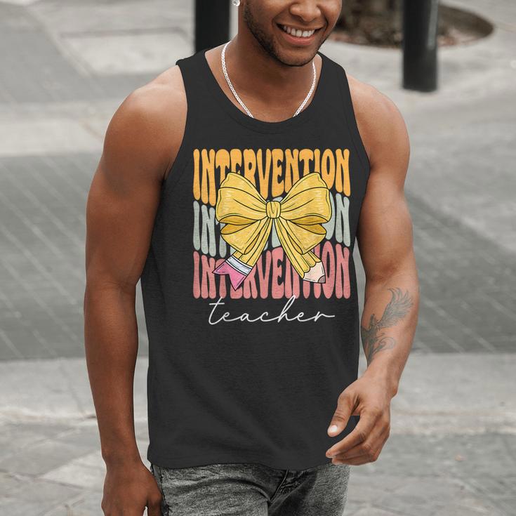 Interventionist Teacher Groovy Coquette Bow Back To School Men Tank Top, Groovy Teacher Tank Tops, funny gift Interventionist Teacher Groovy Coquette Bow Back To School Men Tank Top, Groovy Teacher Tank Tops, funny gift