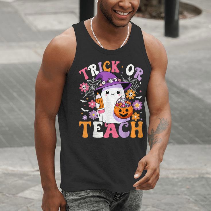 Trick Or Teach Groovy Teacher Ghost Halloween Teacher Men Tank Top, Groovy Teacher Tank Tops, funny gift Trick Or Teach Groovy Teacher Ghost Halloween Teacher Men Tank Top, Groovy Teacher Tank Tops, funny gift