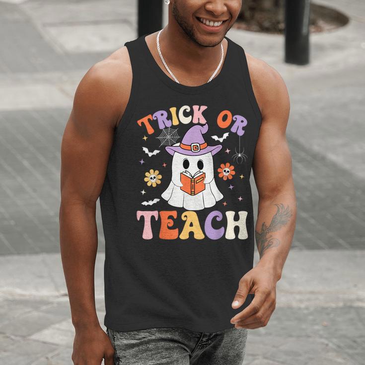 Trick Or Teach Teacher Groovy Ghost Halloween Teacher Men Tank Top, Groovy Teacher Tank Tops, funny gift Trick Or Teach Teacher Groovy Ghost Halloween Teacher Men Tank Top, Groovy Teacher Tank Tops, funny gift