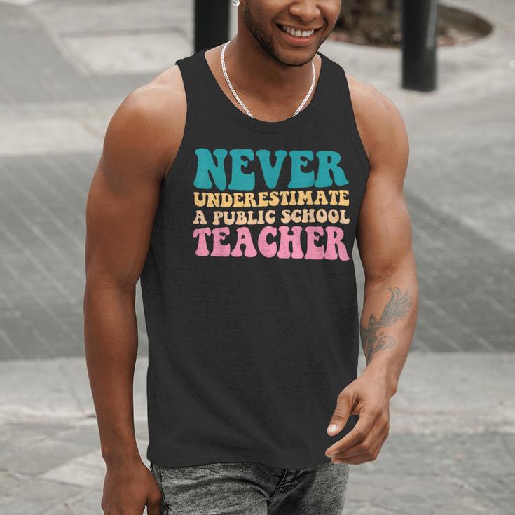 Never Underestimate A Public School Teacher Groovy Women Men Tank Top, Groovy Teacher Tank Tops, funny gift Never Underestimate A Public School Teacher Groovy Women Men Tank Top, Groovy Teacher Tank Tops, funny gift