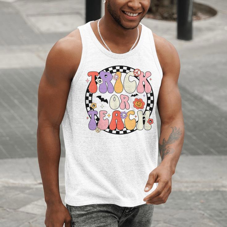 Trick Or Teach Retro Groovy Halloween Teacher Men Tank Top, Groovy Teacher Tank Tops, funny gift Trick Or Teach Retro Groovy Halloween Teacher Men Tank Top, Groovy Teacher Tank Tops, funny gift