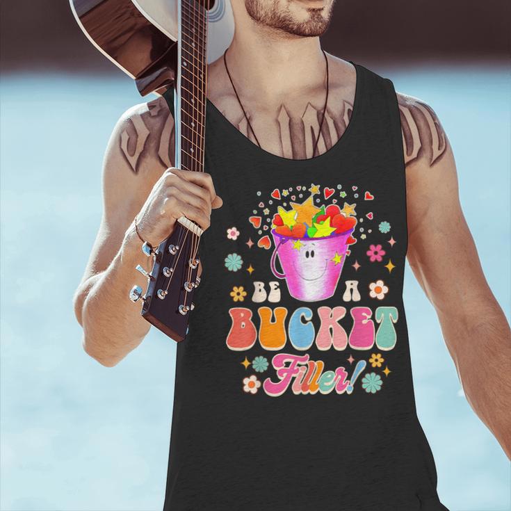 Be A Bucket Filler Teacher Teaching Groovy Back To School For Men Women Men Tank Top, Groovy Teacher Tank Tops, gift for family, gift for coworker Be A Bucket Filler Teacher Teaching Groovy Back To School For Men Women Men Tank Top, Groovy Teacher Tank Tops, gift for family, gift for coworker