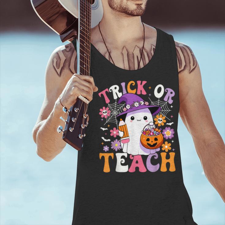 Trick Or Teach Groovy Teacher Ghost Halloween Teacher Men Tank Top, Groovy Teacher Tank Tops, gift for family, gift for coworker Trick Or Teach Groovy Teacher Ghost Halloween Teacher Men Tank Top, Groovy Teacher Tank Tops, gift for family, gift for coworker