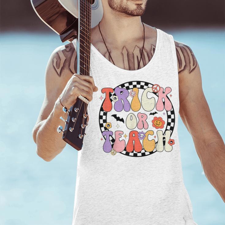 Trick Or Teach Retro Groovy Halloween Teacher Men Tank Top, Groovy Teacher Tank Tops, gift for family, gift for coworker Trick Or Teach Retro Groovy Halloween Teacher Men Tank Top, Groovy Teacher Tank Tops, gift for family, gift for coworker