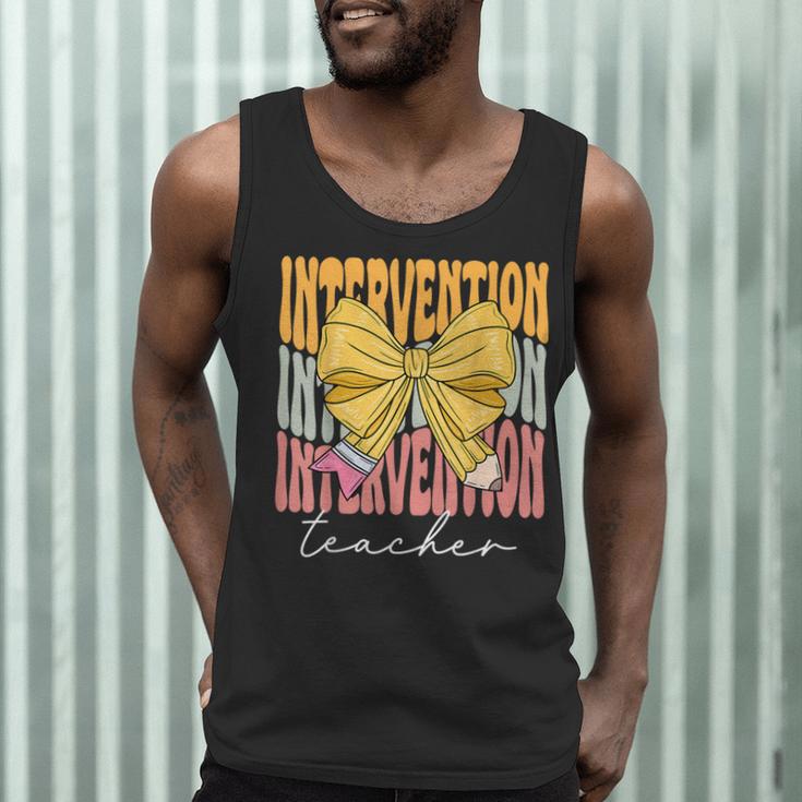 Interventionist Teacher Groovy Coquette Bow Back To School Men Tank Top, novelty gifts, funny gifts Interventionist Teacher Groovy Coquette Bow Back To School Men Tank Top, novelty gifts, funny gifts