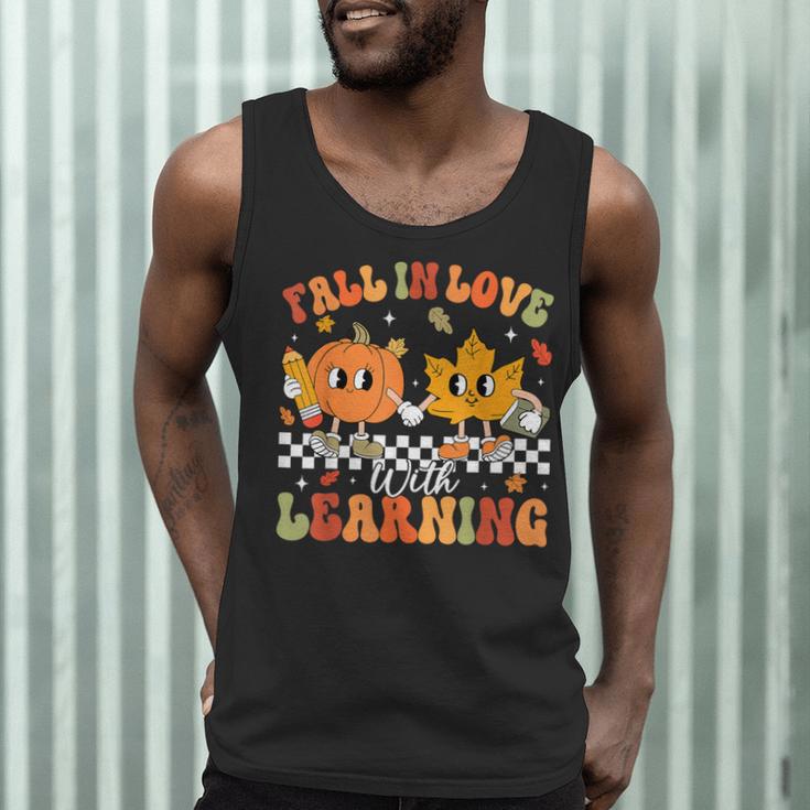 Retro Pumpkin Fall In Love With Learning Autumn Teacher Men Tank Top, novelty gifts, funny gifts