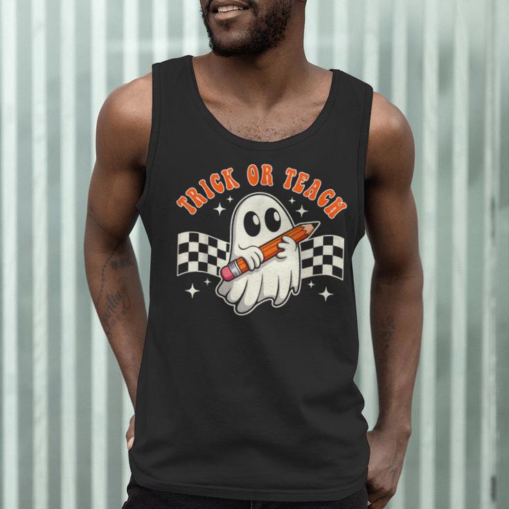 Trick Or Teach Groovy Retro Ghost Halloween Teacher Kids Men Tank Top, novelty gifts, funny gifts