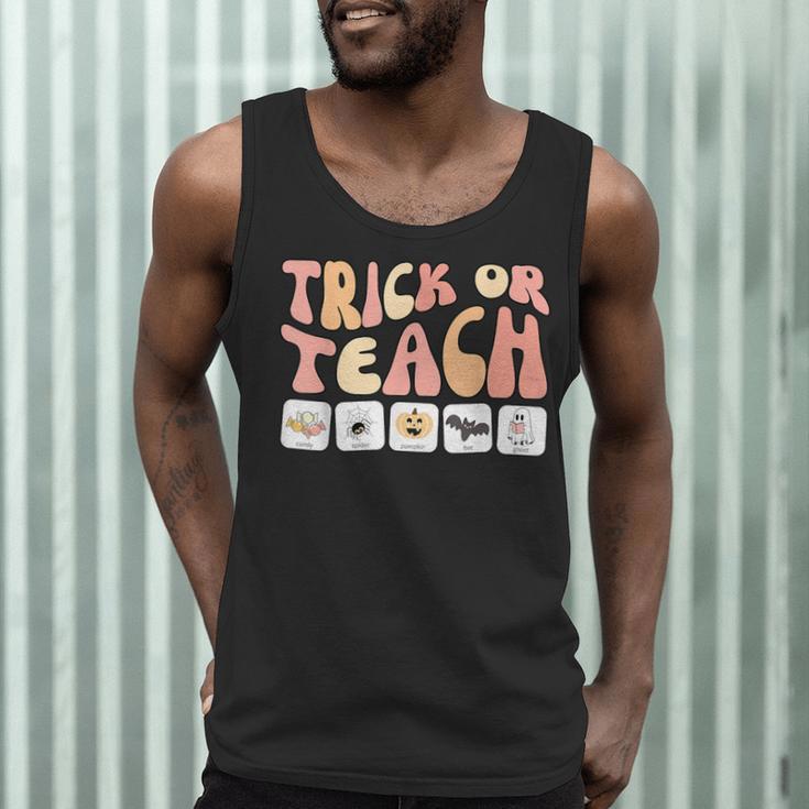Trick Or Teach With Symbols Special Education Teacher Spooky Men Tank Top, novelty gifts, funny gifts