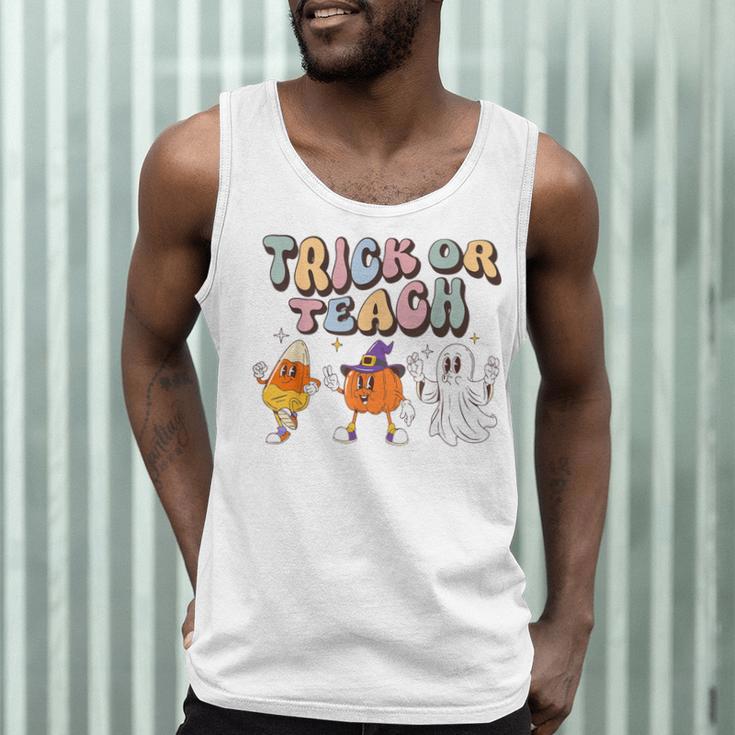Trick Or Teach Candy Corn Pumpkin Ghost Teacher Men Tank Top, novelty gifts, funny gifts