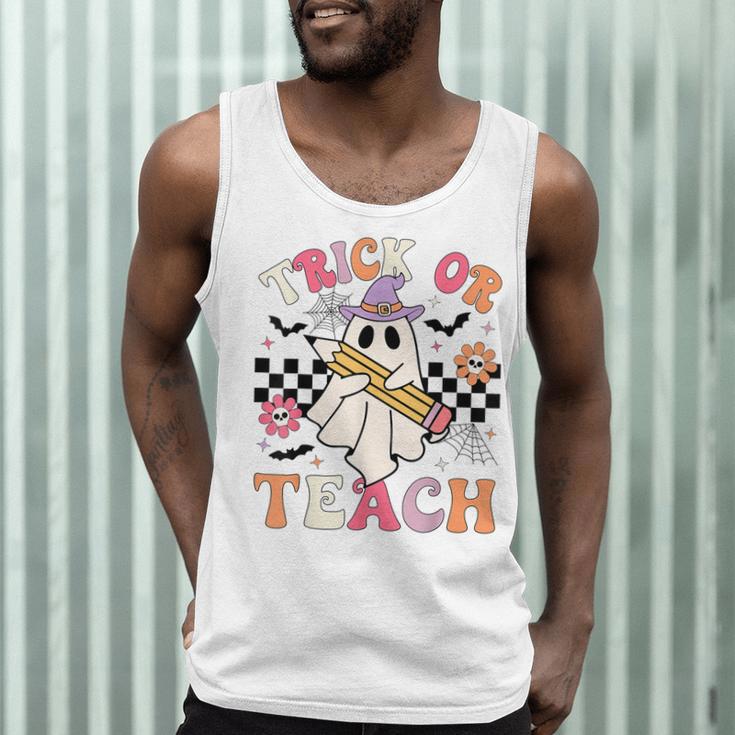 Trick Or Teach Groovy Teacher Halloween Retro Floral Ghost Men Tank Top, novelty gifts, funny gifts Trick Or Teach Groovy Teacher Halloween Retro Floral Ghost Men Tank Top, novelty gifts, funny gifts