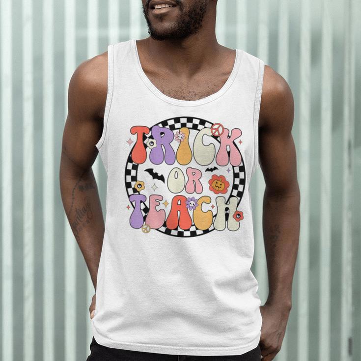 Trick Or Teach Retro Groovy Halloween Teacher Men Tank Top, novelty gifts, funny gifts Trick Or Teach Retro Groovy Halloween Teacher Men Tank Top, novelty gifts, funny gifts