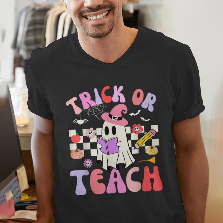 Trick Or Teach Halloween Teacher Floral Ghost Groovy Men's V-Neck T-Shirt, Groovy Teacher Shirts, funny gift Trick Or Teach Halloween Teacher Floral Ghost Groovy Men's V-Neck T-Shirt, Groovy Teacher Shirts, funny gift