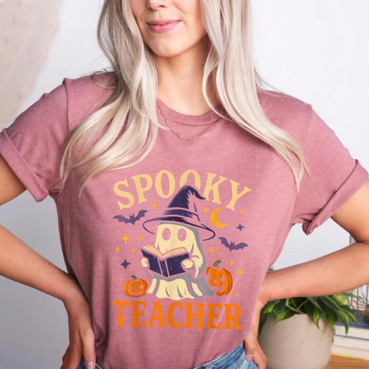Spooky Teacher Halloween Cute Ghost Pumpkin Reading Women Women's Heather T-Shirt