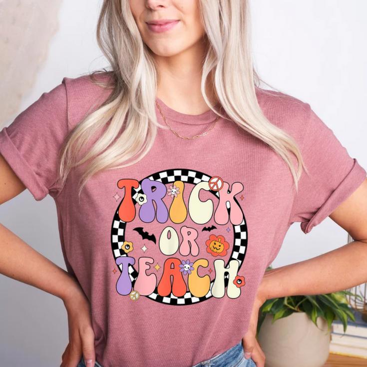Trick Or Teach Retro Groovy Halloween Teacher Women's Heather T-Shirt Trick Or Teach Retro Groovy Halloween Teacher Women's Heather T-Shirt