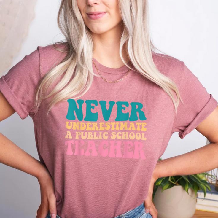 Never Underestimate A Public School Teacher Groovy Women Women's Heather T-Shirt