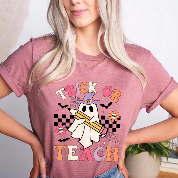 Trick Or Teach Groovy Teacher Halloween Retro Floral Ghost Women's Heather T-Shirt