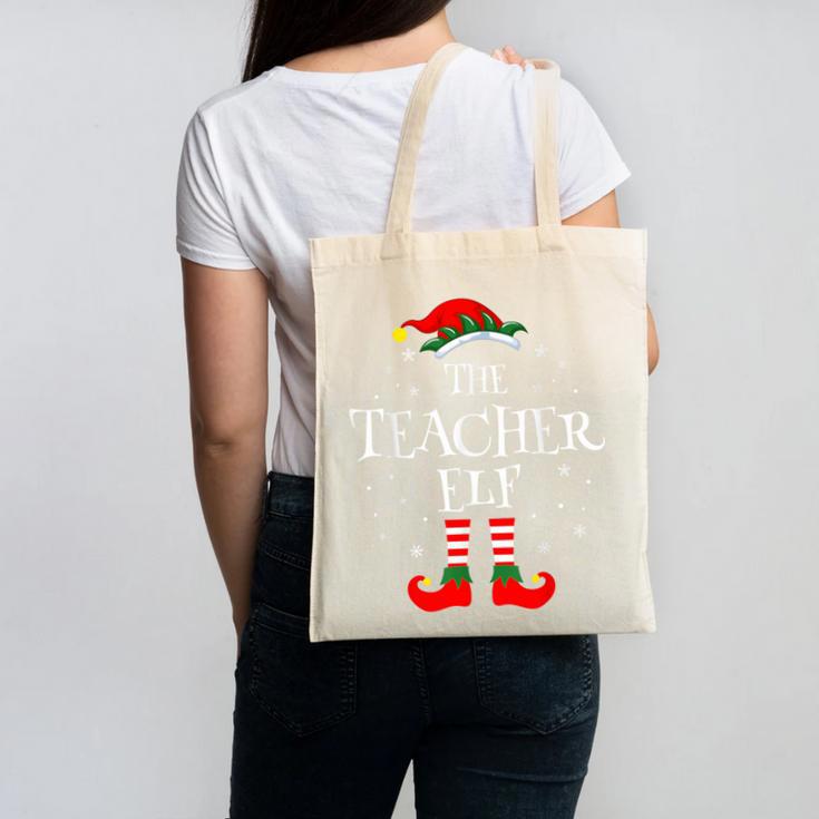 The Teacher Elf Christmas Family Matching Group Xmas Canvas Tote Bag, trending gift The Teacher Elf Christmas Family Matching Group Xmas Canvas Tote Bag, trending gift