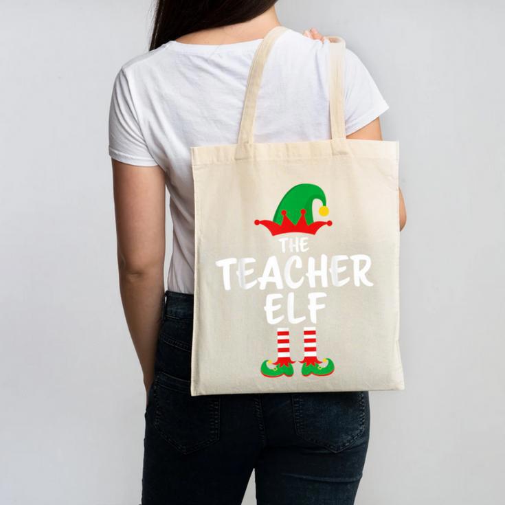 The Teacher Elf Matching Family Christmas Canvas Tote Bag, trending gift The Teacher Elf Matching Family Christmas Canvas Tote Bag, trending gift