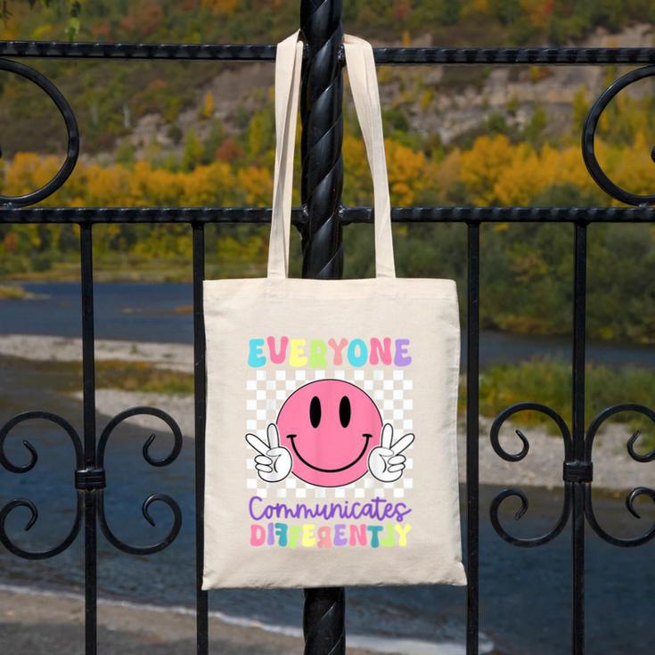 Everyone Communicates Differently Autism Awareness Teacher Canvas Tote Bag, funny design