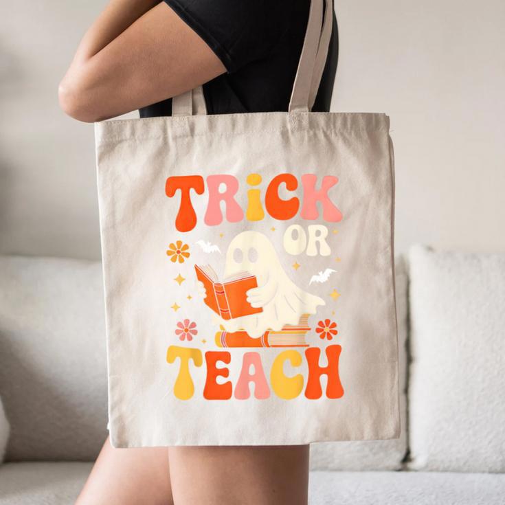 Trick Or Teach Halloween Shirt For Teacher Kids Floral Ghost Canvas Tote Bag, novelty gifts, funny gifts