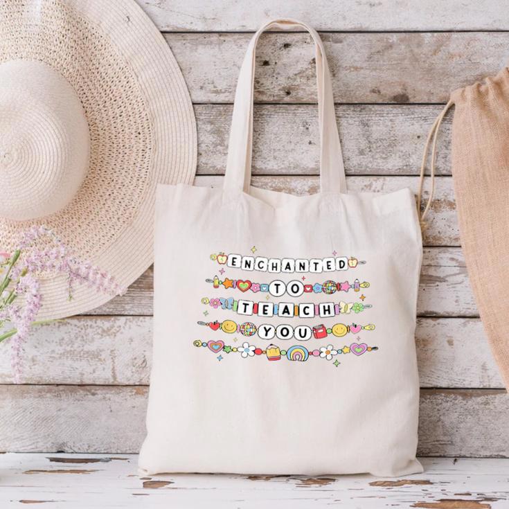 Enchanted To Teach You Friendship Bracelet Teacher Girl Kids Canvas Tote Bag, gift for family, gift for coworker Enchanted To Teach You Friendship Bracelet Teacher Girl Kids Canvas Tote Bag, gift for family, gift for coworker