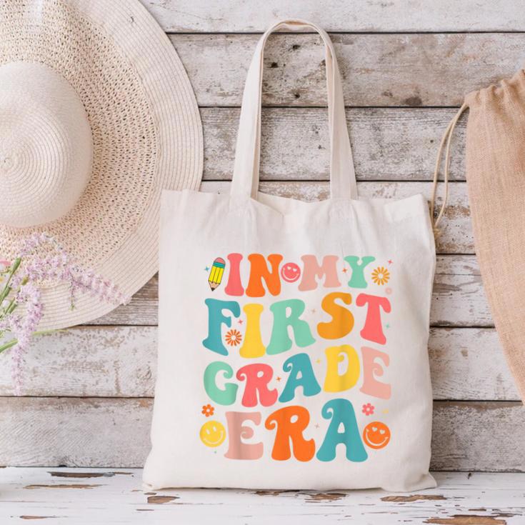 In My First Grade Era 1st Grade Teacher Back To School Canvas Tote Bag, First Grade Teacher Tote Bags, gift for family, gift for coworker In My First Grade Era 1st Grade Teacher Back To School Canvas Tote Bag, First Grade Teacher Tote Bags, gift for family, gift for coworker