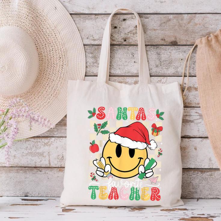 Santas Favorite Teacher Retro Groovy Smile Face Christmas Canvas Tote Bag, Groovy Teacher Tote Bags, gift for family, gift for coworker Santas Favorite Teacher Retro Groovy Smile Face Christmas Canvas Tote Bag, Groovy Teacher Tote Bags, gift for family, gift for coworker