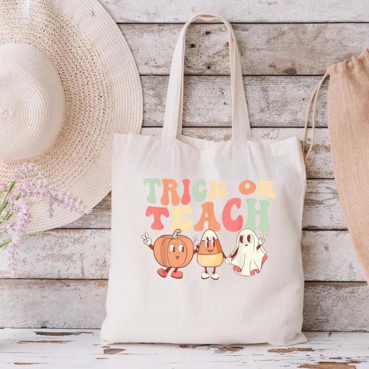 Trick Or Teach Pumpkin Candy Corn Ghost Halloween Teacher Canvas Tote Bag, gift for family, gift for coworker Trick Or Teach Pumpkin Candy Corn Ghost Halloween Teacher Canvas Tote Bag, gift for family, gift for coworker