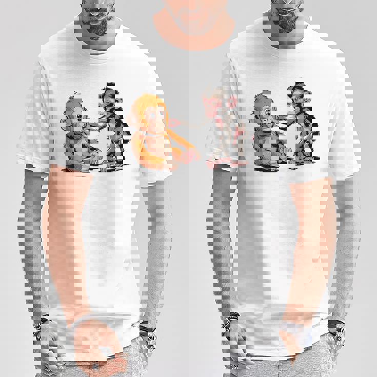 オレンジのおもちゃで悲しい猿のパンチ Tシャツ 面白い贈り物