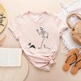 Halloween Boston Terrier And Skeleton Women's Heather T-Shirt Heather Peach