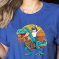 Boston Terrier Dog Riding Dinosaur T Rex Boys Women's Heather T-Shirt Heather True Royal